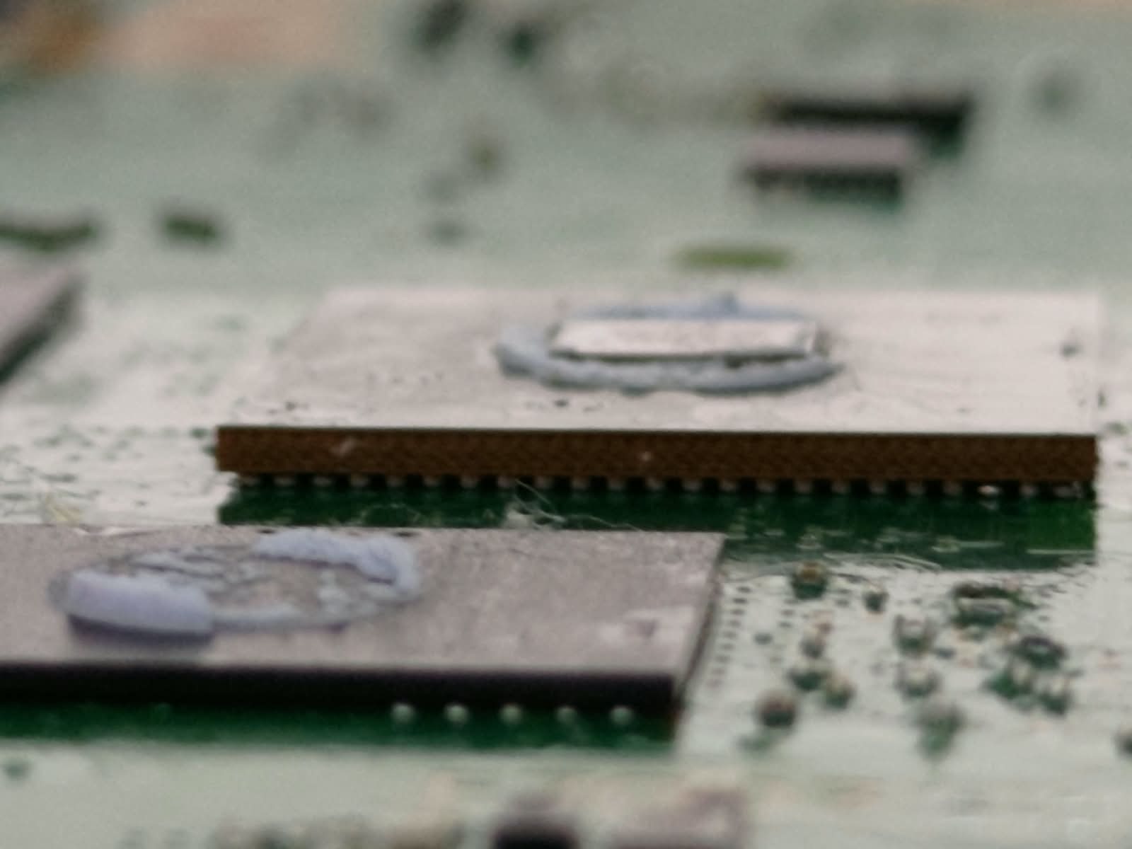 Reballed PS5 SSD controller seated on the motherboard