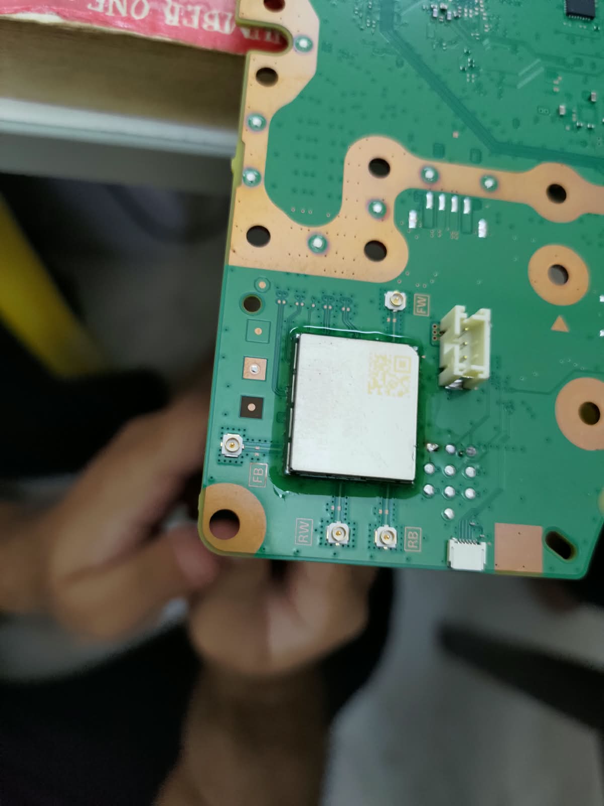 Replacement Wi-Fi chip fitted on a PS5 motherboard